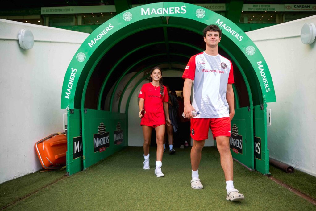 two junior soccer players walking out of the tunnel at Celtic Park