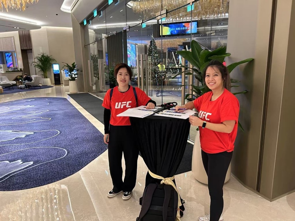 Destination Sport China greeting UFC guests at a hotel in Macau