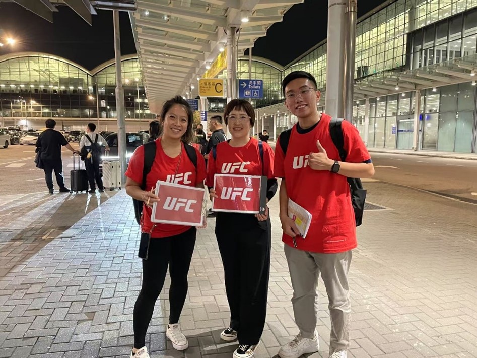 Staff from Destination Sport China welcome guests at Hong Kong International Airport