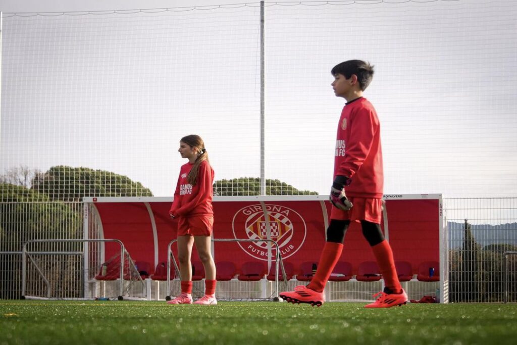 Two young soccer players training at Girona FA academy in Spain