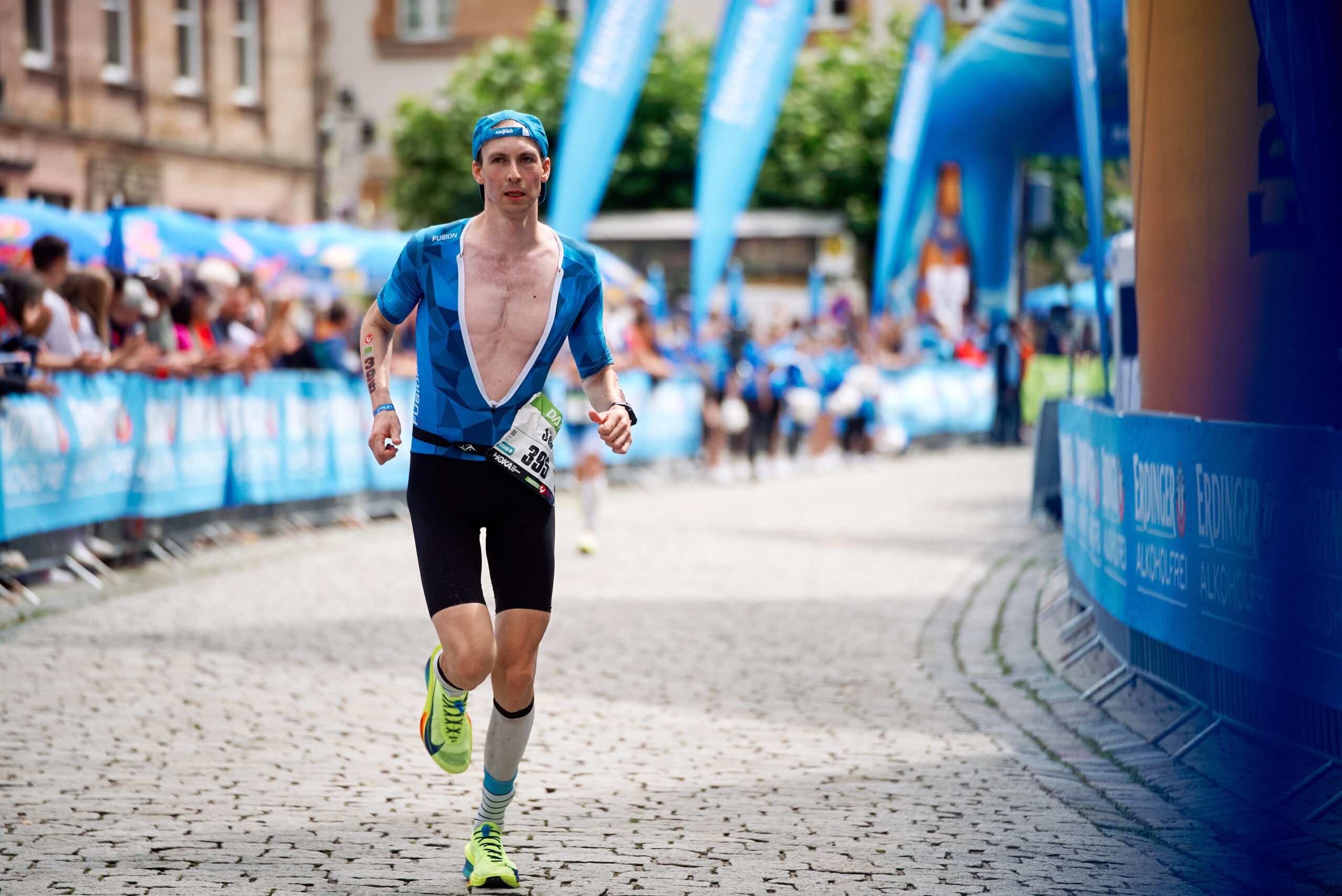 A triathlete pushes on during the Challenge Roth triathlon